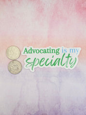 a sticker with the text "Advocating Specialty" and two US coins, one of which is a quarter.